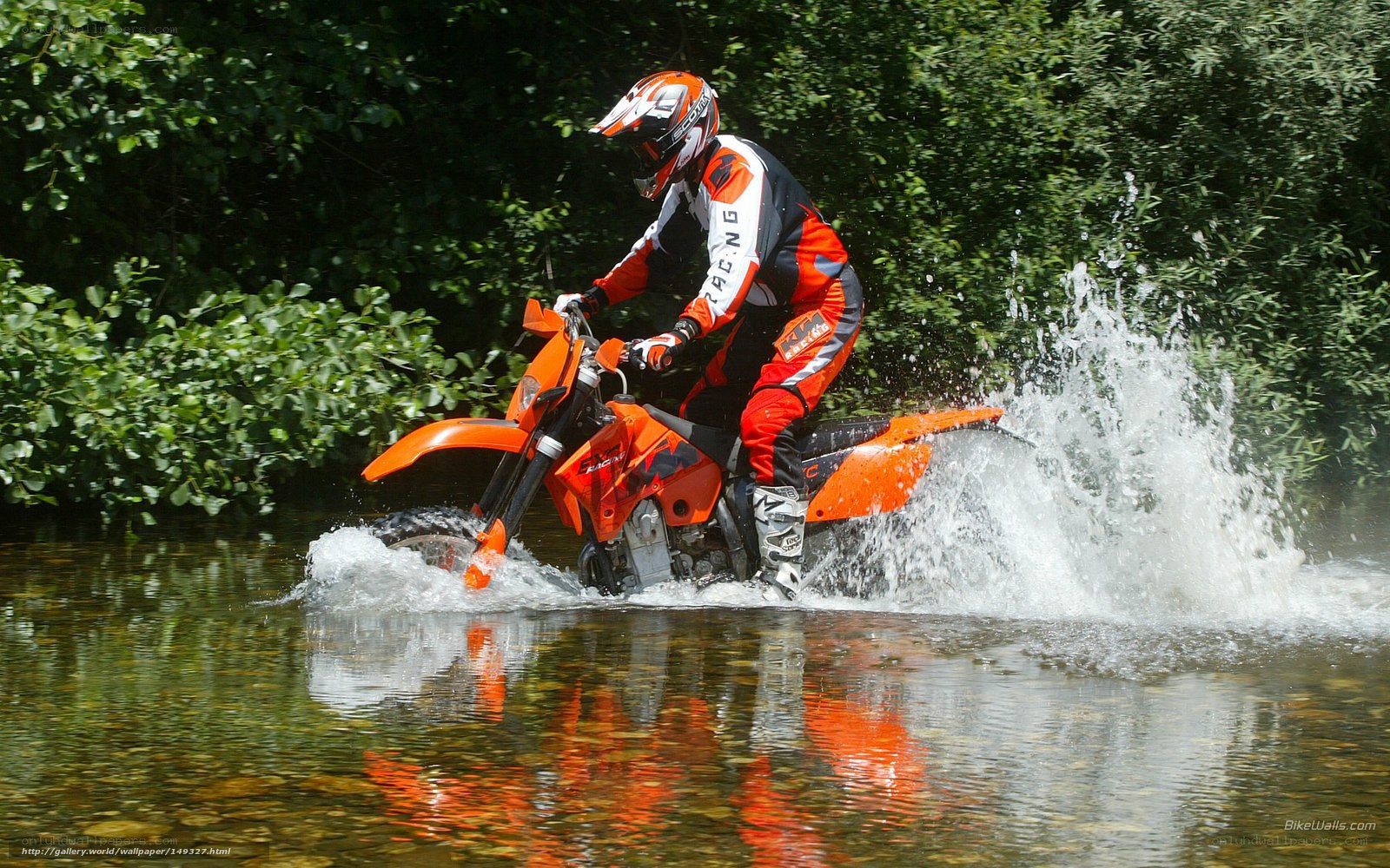 Motorcyclist riding through water