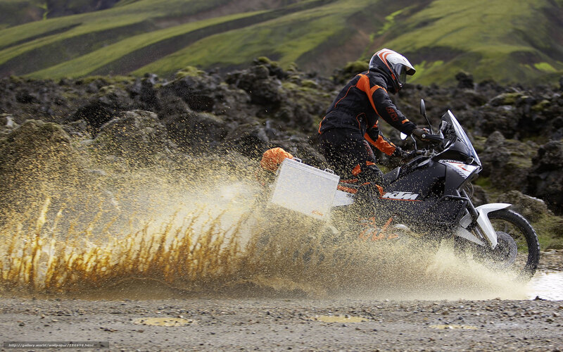 Motorcyclist riding through water