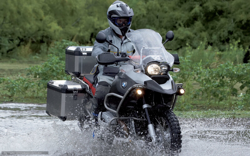 Motorcyclist riding through water