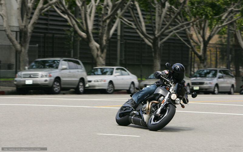 Motorcyclist Turning on Road