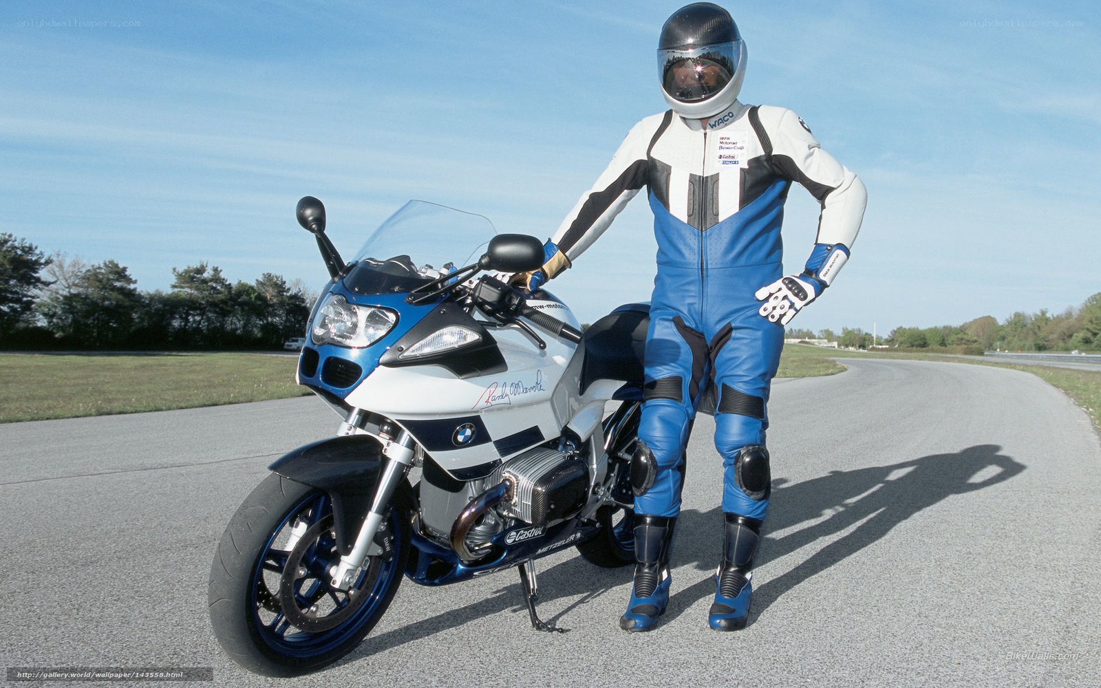 motorcyclist with blue and white bike