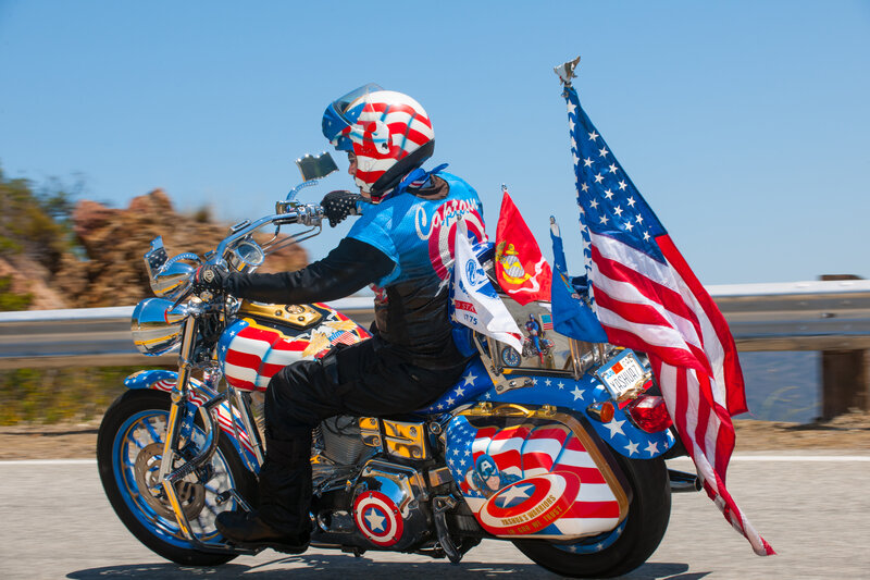 Motorcyclist with Flags