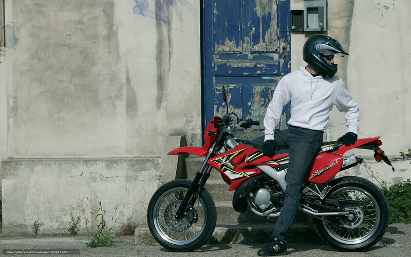 motorcyclist with red bike