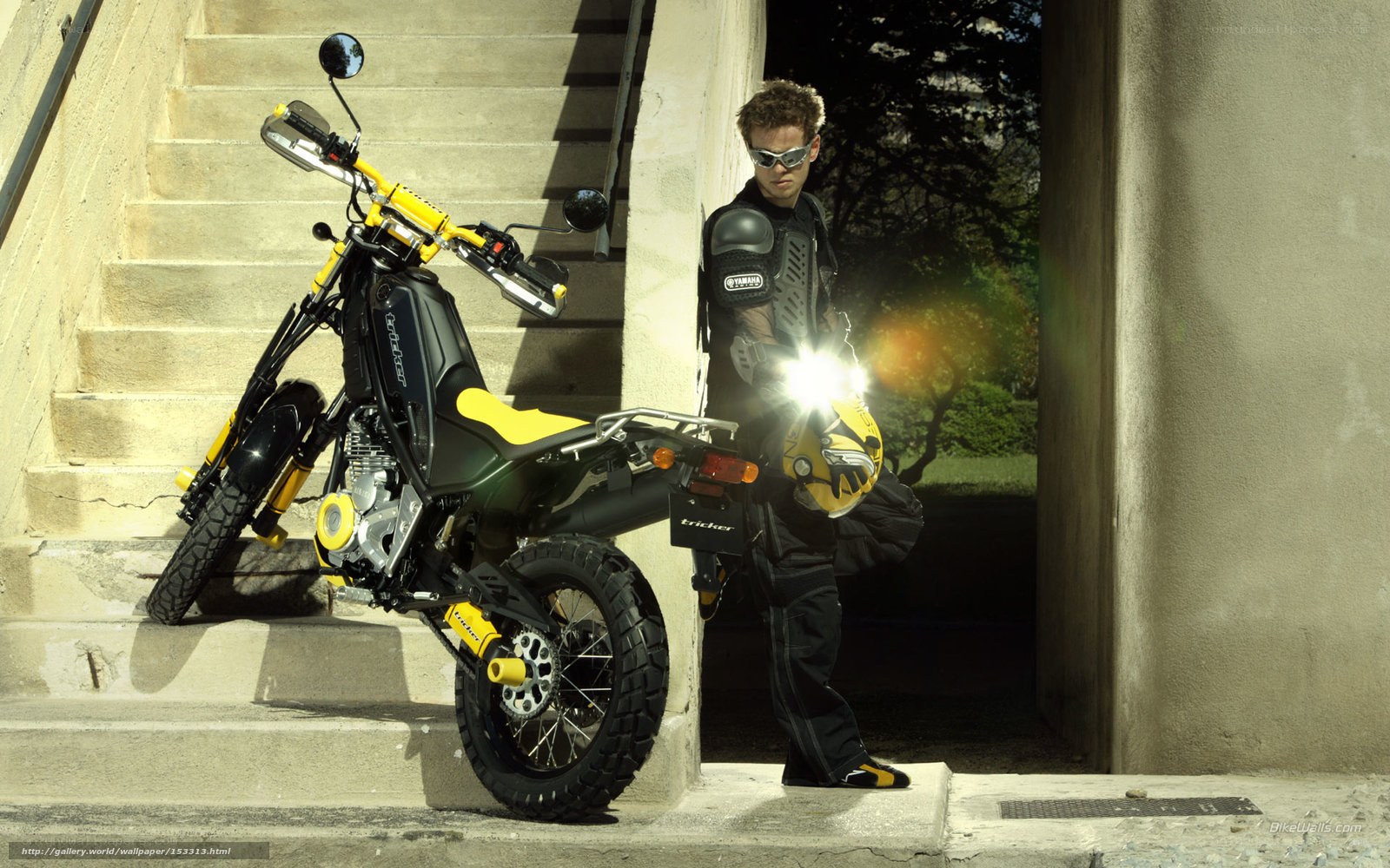 motorcyclist with yellow bike