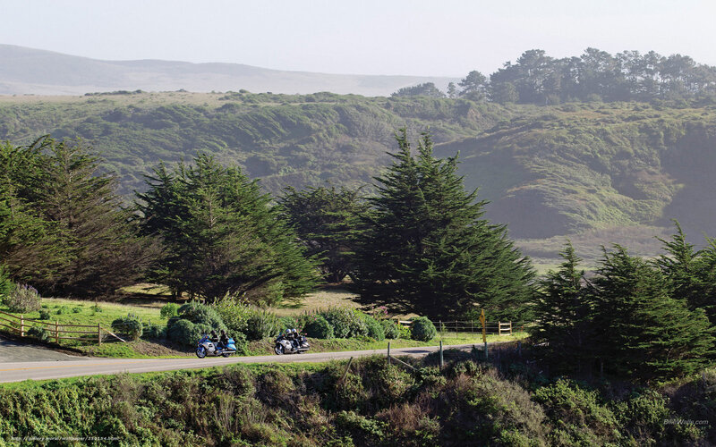 Motorcyclists on a coastal road