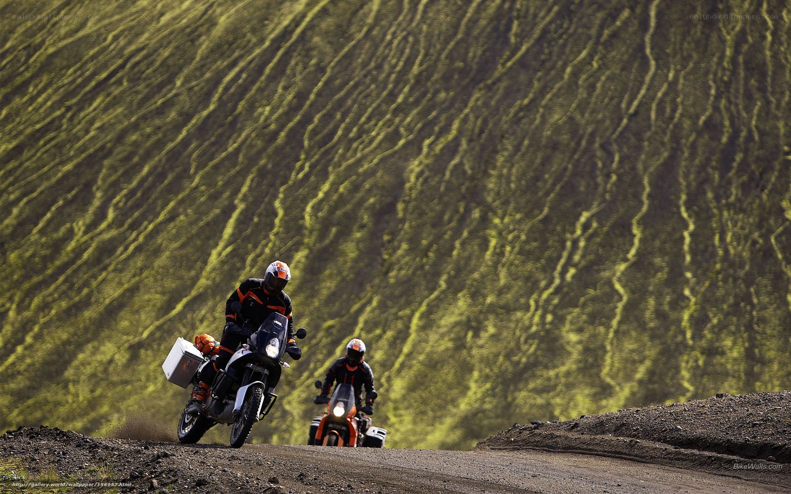 Motorcyclists on a dirt road
