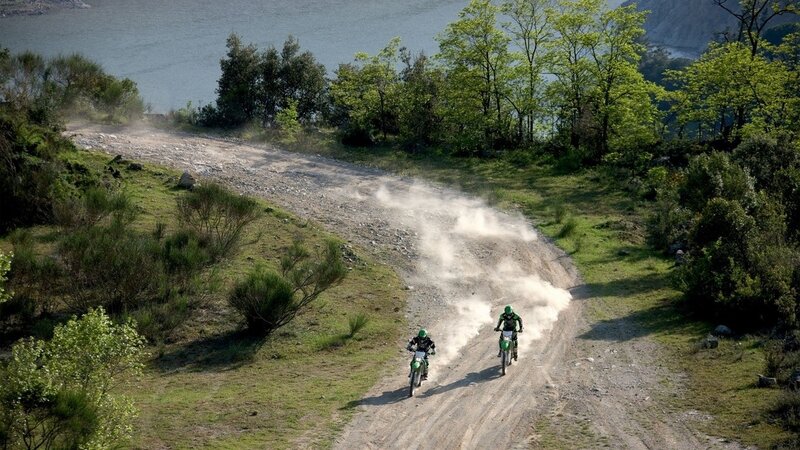Motorcyclists on a dirt road