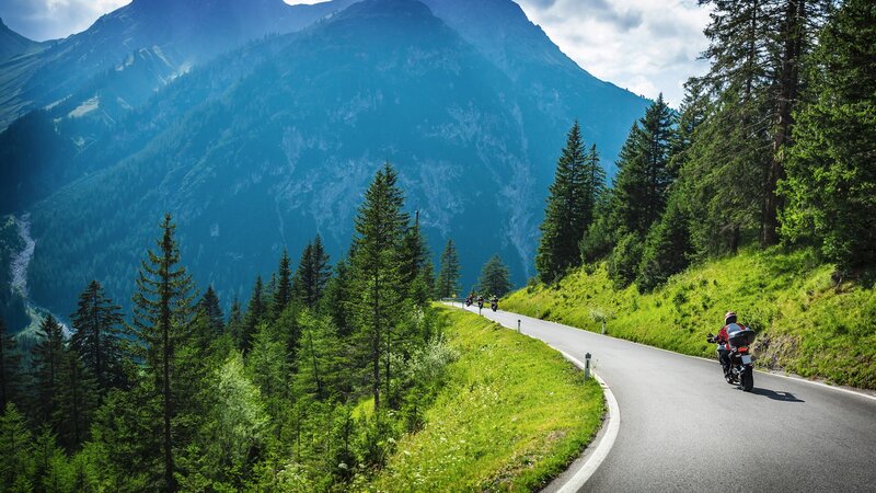 Motorcyclists on Mountain Road — Green, Serene, Afternoon, Photograph
