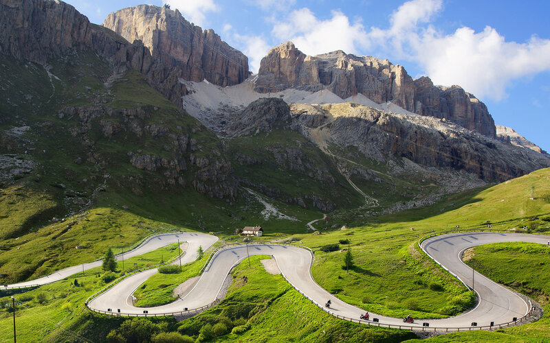 Motorcyclists on Mountain Road — Green, Serene, Afternoon