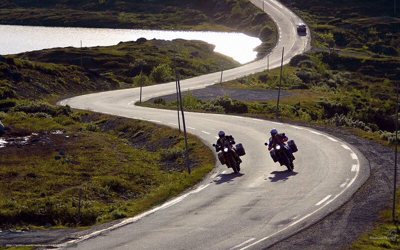 Motorcyclists on Winding Road — Green, Serene