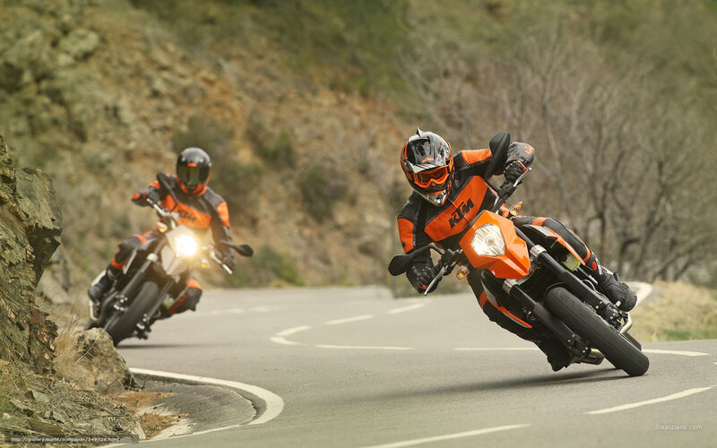 Motorcyclists on Winding Road — Orange