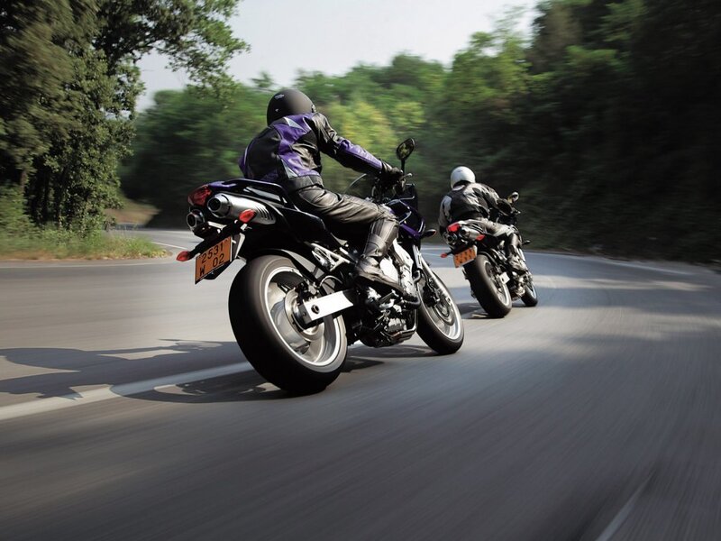 Motorcyclists riding on a road