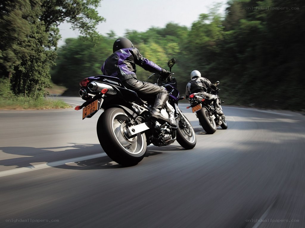 Motorcyclists riding on a road
