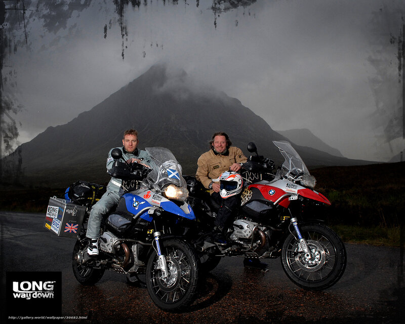 Motorcyclists with mountains