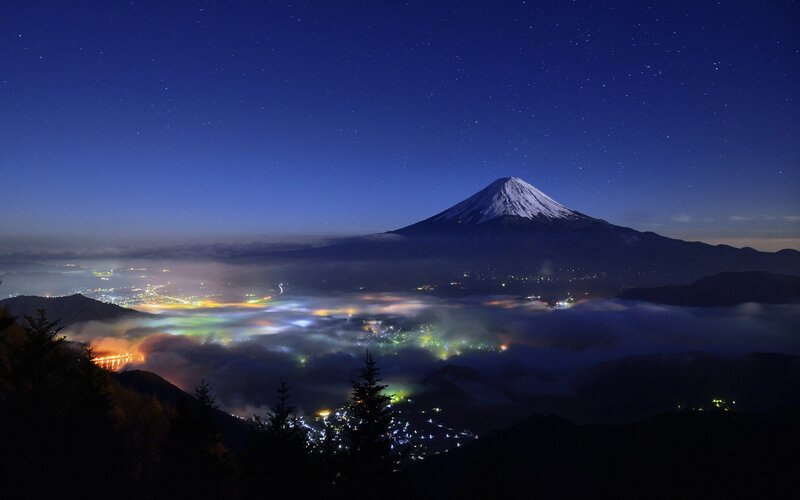 Mount Fuji at Night — Blue, Serene, Photograph, Mountain, Clouds, City Lights