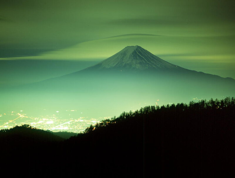 Mount Fuji at night with green sky
