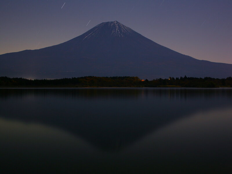 Mount Fuji at night with star trails