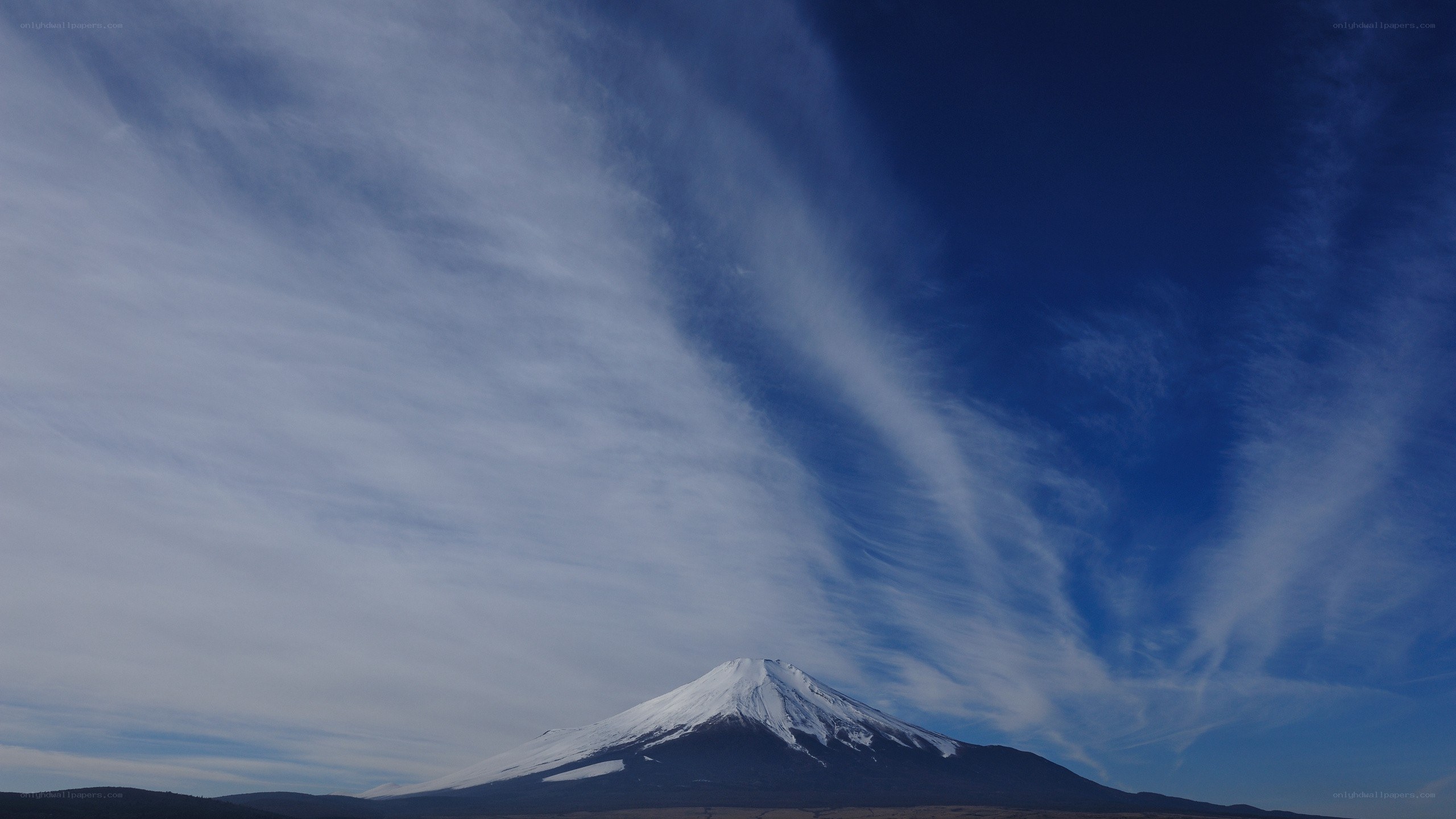 Mount Fuji under a cloudy sky