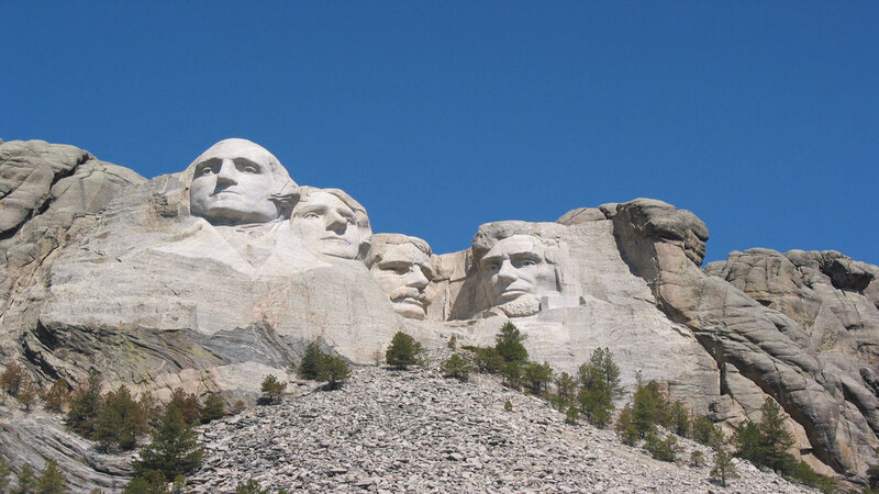 Mount Rushmore Monument — Blue, Dramatic, Afternoon, Photograph, Rock Faces, Trees, Sky