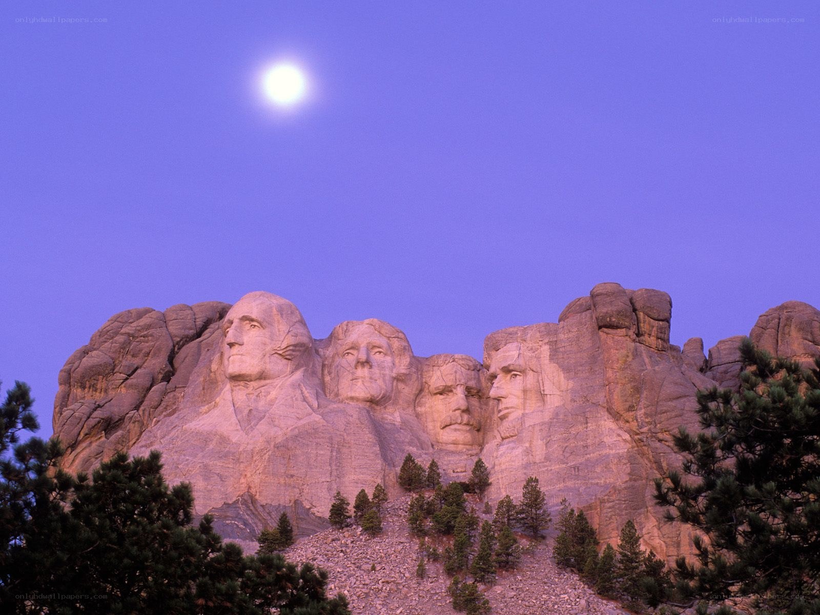 Mount Rushmore under moonlight