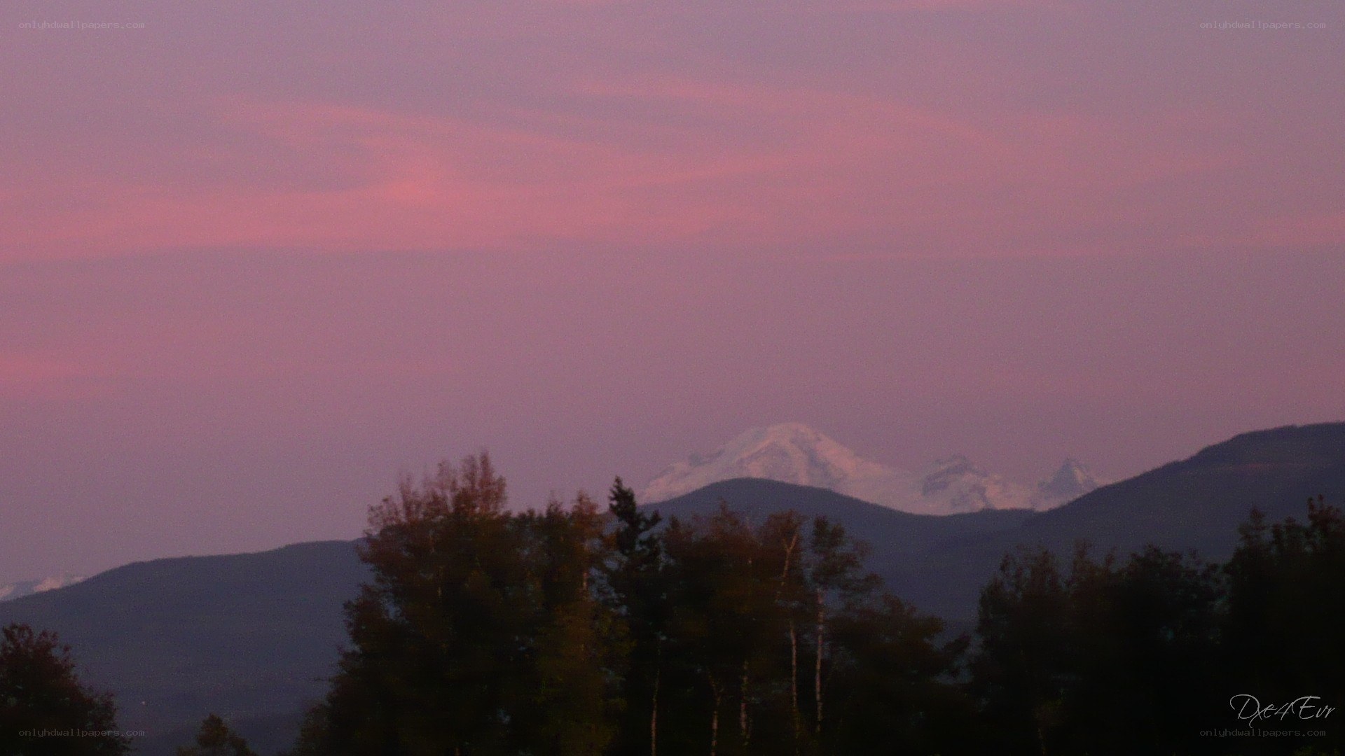 mountain at dusk with pink sky