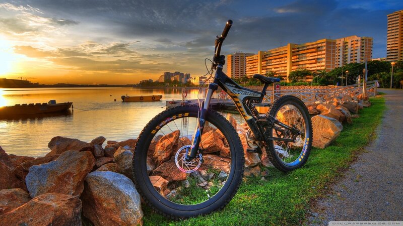 Mountain bike at sunset by the water