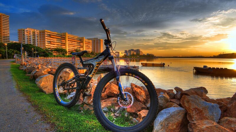 Mountain bike at sunset by the water