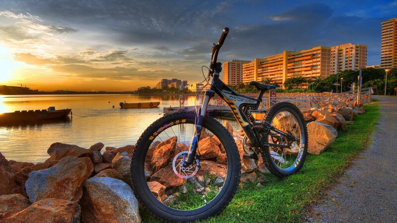 Mountain bike at sunset by the water