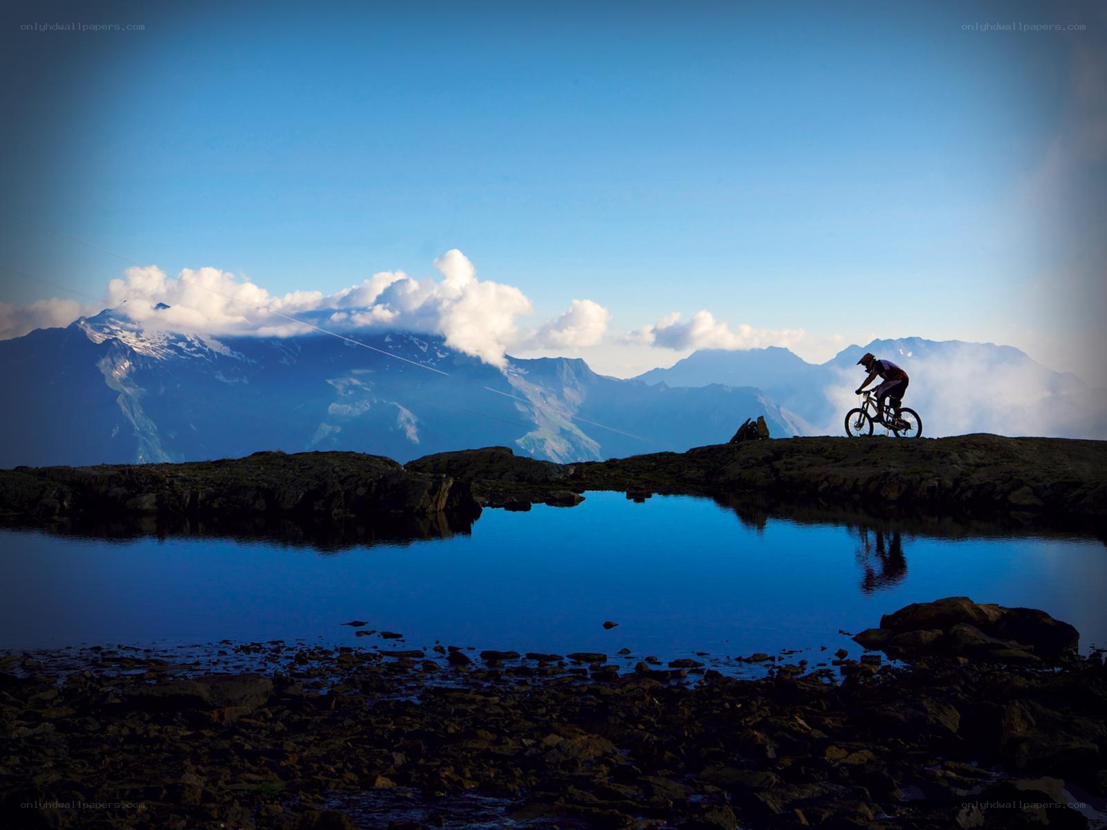 Mountain biker at alpine lake