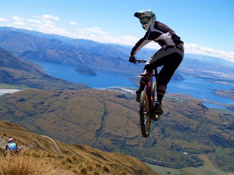 Mountain Biker in Mid-air — Blue, Adventurous, Afternoon