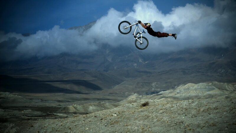 Mountain Biker in Mid-air — Blue, Dramatic, Afternoon