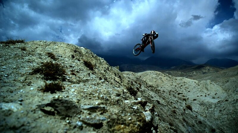 Mountain Biker in Mid-air — Blue, Dramatic, Photograph
