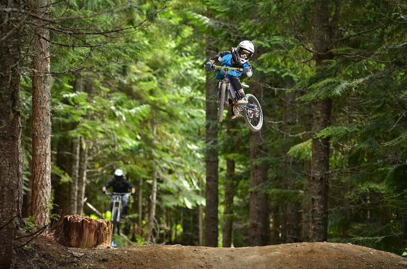 Mountain Biker in Mid-air — Green, Active, Afternoon, Photograph, Forest
