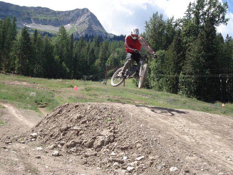 Mountain Biker in Mid-air — Green, Active, Afternoon