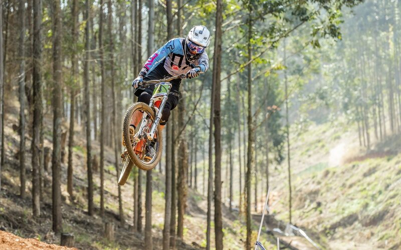 Mountain Biker in Mid-air — Green, Dynamic, Afternoon