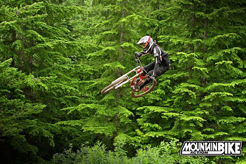 Mountain Biker in Mid-air — Green, Dynamic, Summer