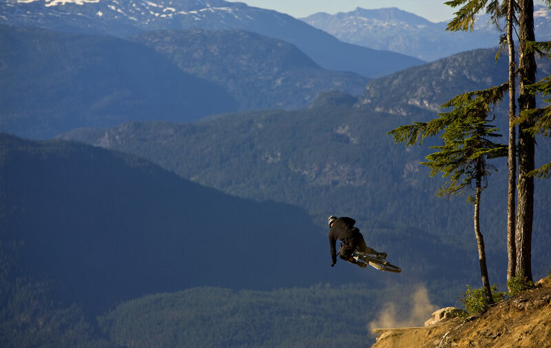 Mountain biker in mid-air jump