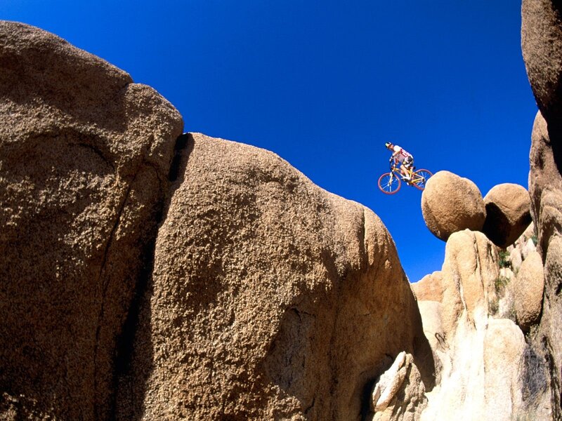 Mountain biker in mid-air jump