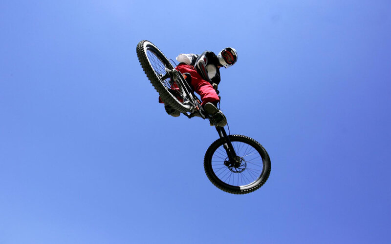 Mountain biker in mid-air jump