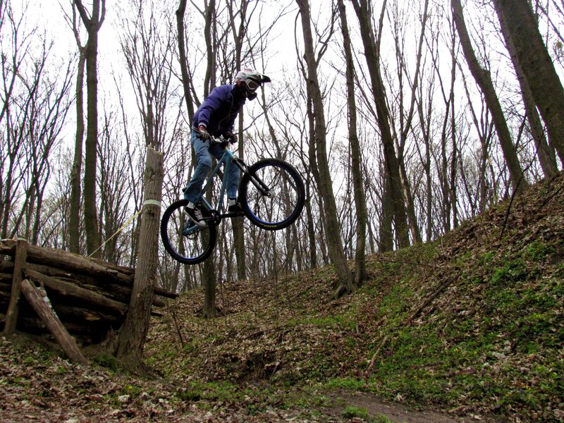 Mountain biker in mid-air jump