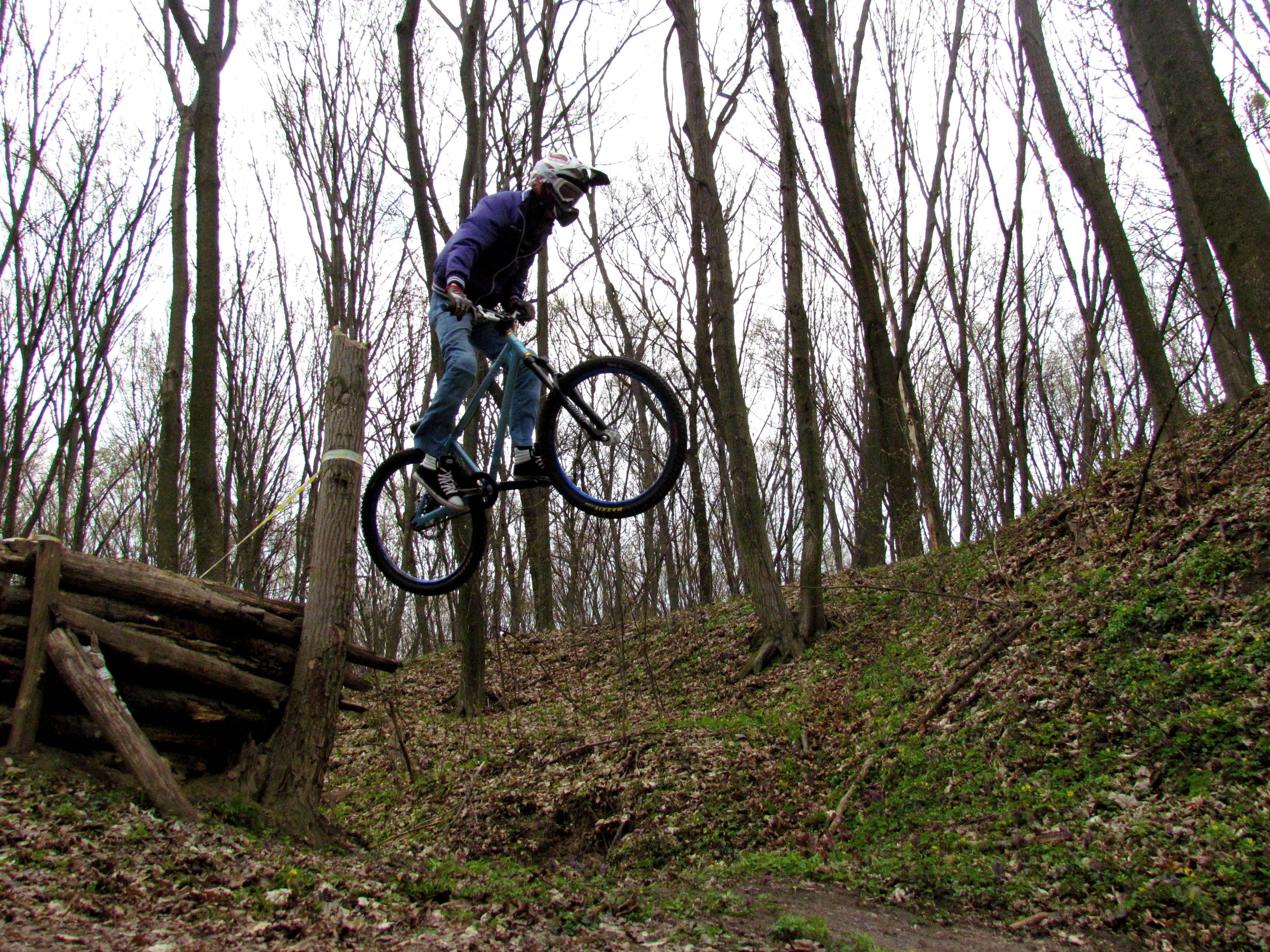 Mountain biker in mid-air jump