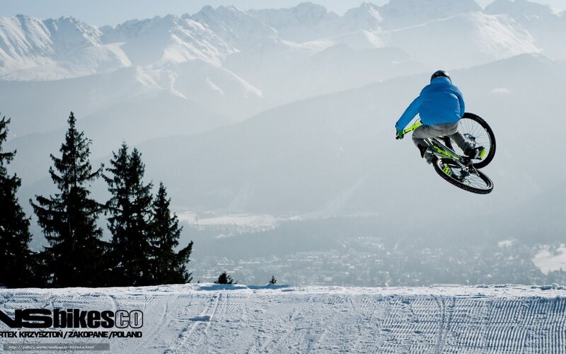 Mountain Biker in Mid-air — White