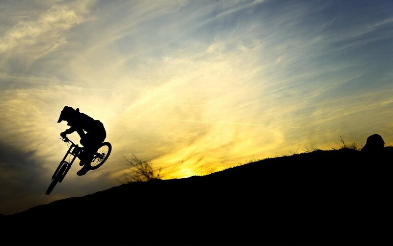 Mountain Biker in Mid-air — Yellow