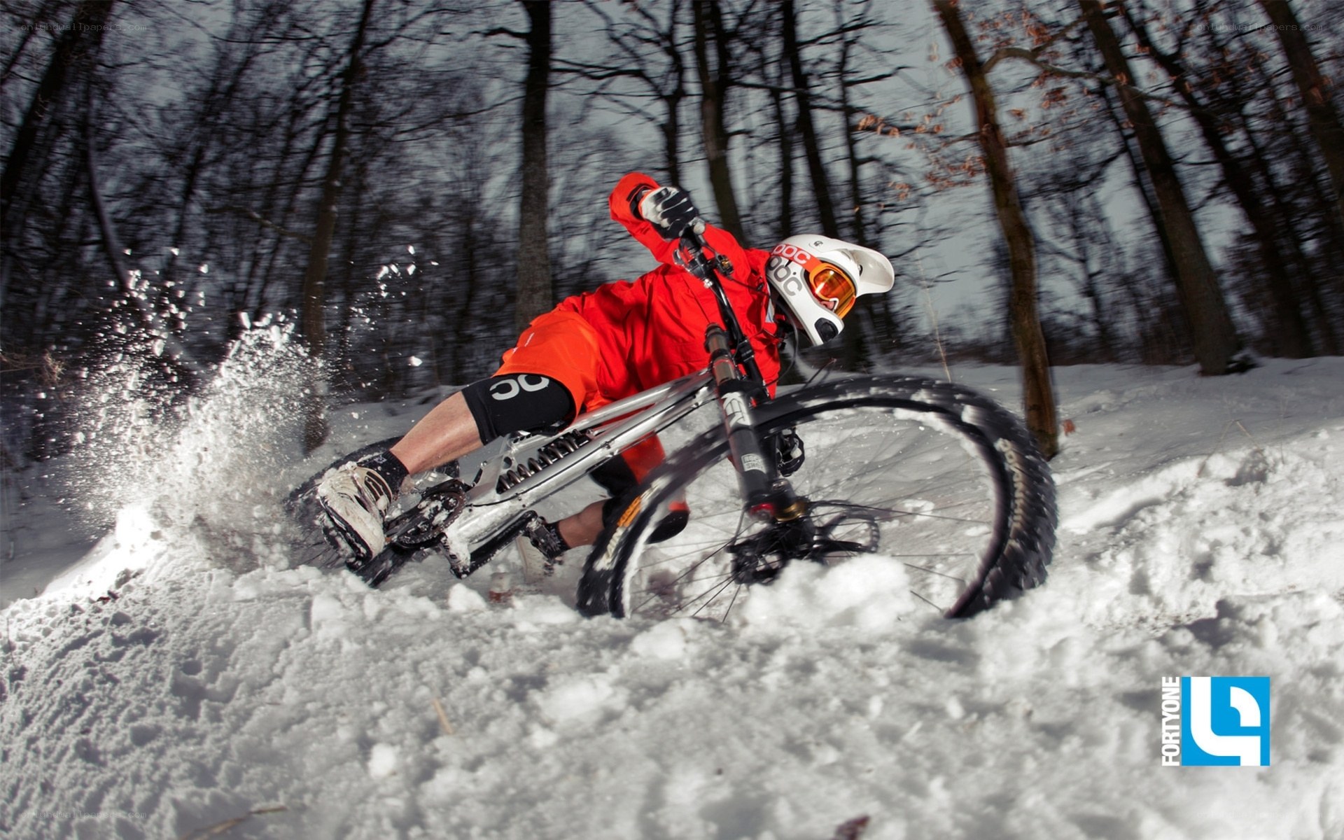 Mountain biker in snowy forest