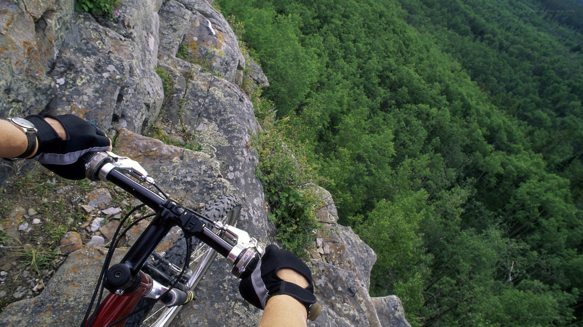 Mountain biker on a cliff edge