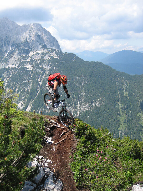 Mountain biker on a cliff edge