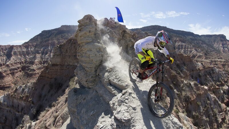 Mountain Biker on Cliff — Brown