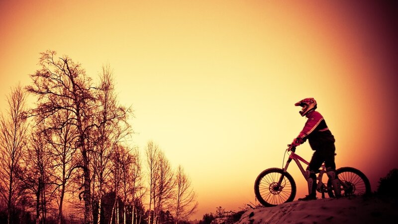 Mountain Biker on Hill — Orange