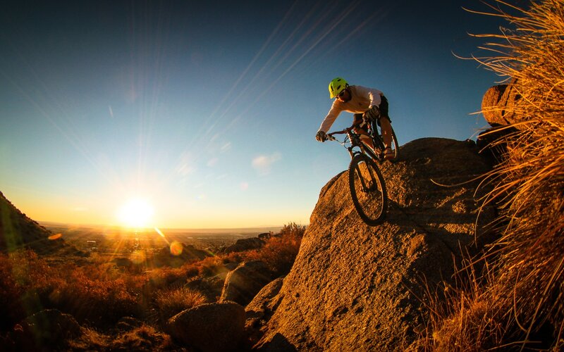 Mountain Biker on Rock — Blue, Dramatic, Sunset