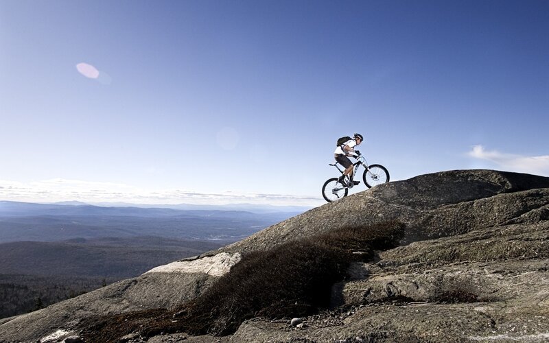 Mountain Biker on Rock — Blue